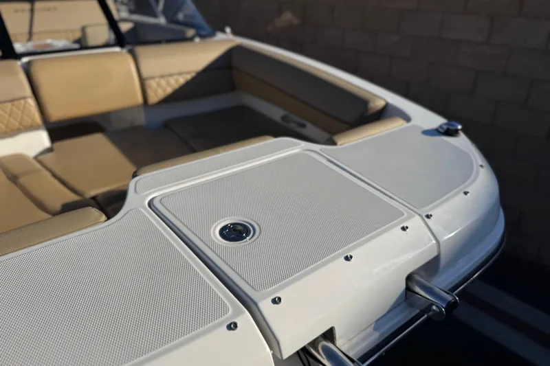 Slide: The Image of 2023 Bayliner DX 2050 boat interior with tan seating and sleek design. - 9