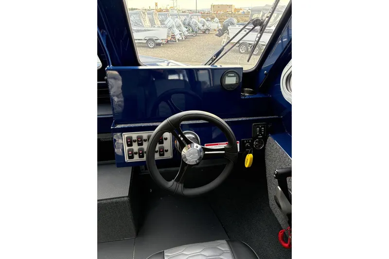 Slide: The Image of Steering console of 2026 Weldcraft 210 Revolution HT boat, featuring modern controls and dashboard. - 18