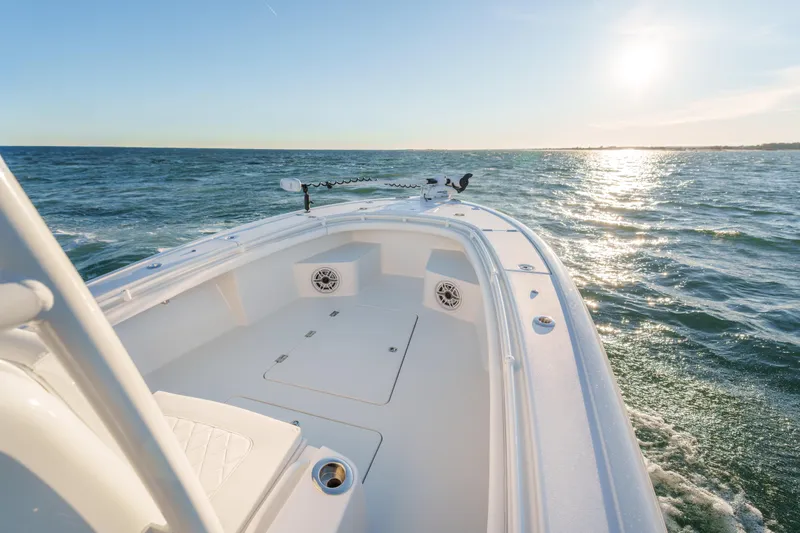 Slide: The Image of BARKER 26 boat cruising on ocean at sunset, 2020 model. - 10