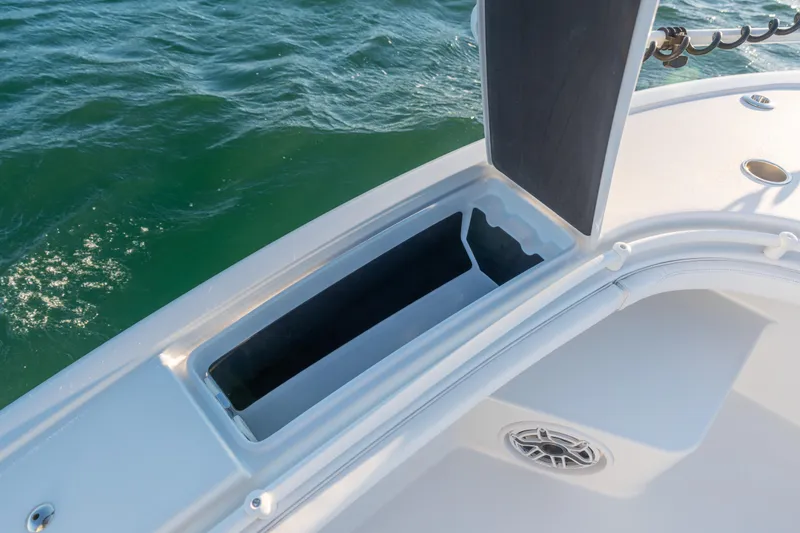 Slide: The Image of Open storage compartment on 2020 BARKER 26 boat, with ocean background. - 16