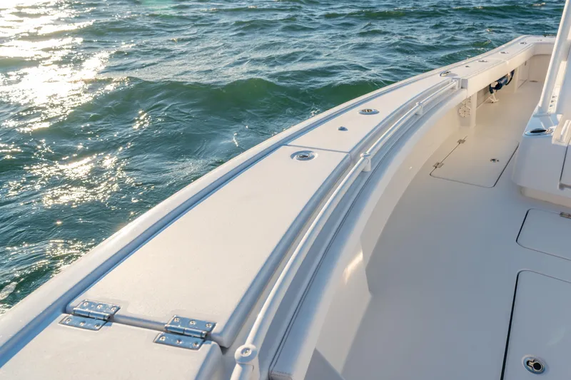 Slide: The Image of BARKER 26 boat deck, 2020 model, on shimmering water. - 17