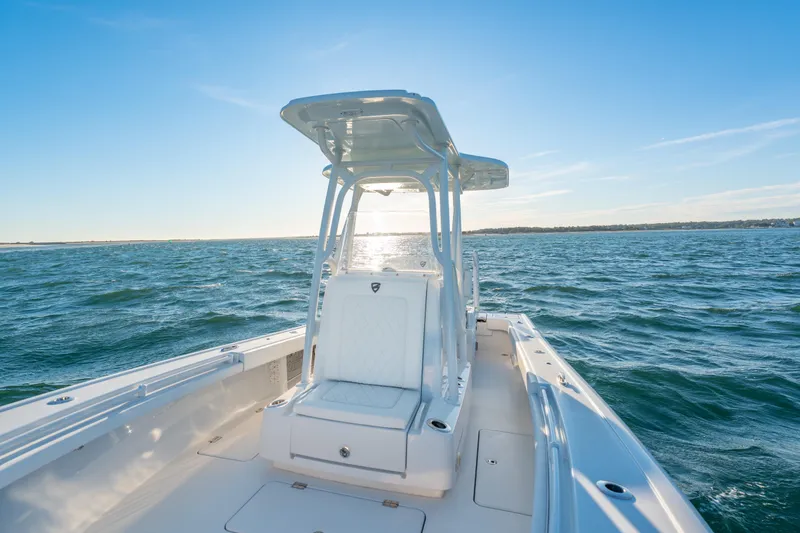 Slide: The Image of 2020 BARKER 26 boat on open water under clear blue sky. - 19