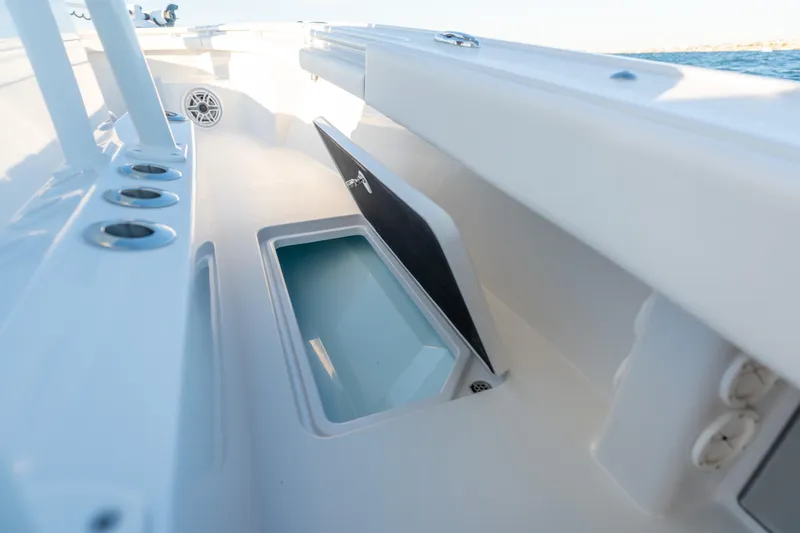 Slide: The Image of BARKER 26 boat interior, open storage compartment, sleek design, 2020 model. - 37