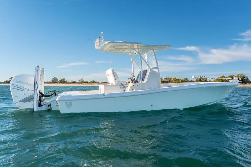 Slide: The Image of 2020 BARKER 26 boat on water, clear sky, side view. - 4