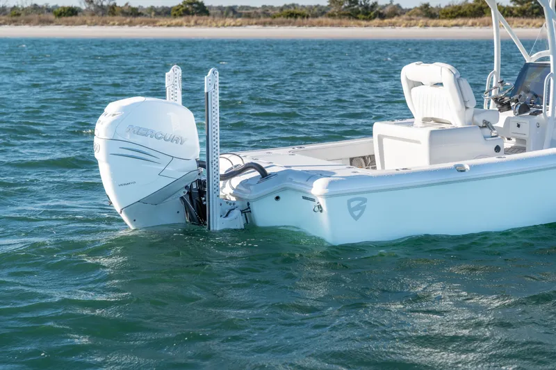 Slide: The Image of 2020 BARKER 26 boat with Mercury engine on open water. - 5