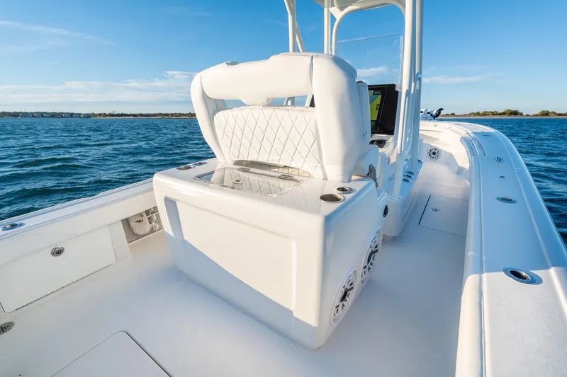 Slide: The Image of 2020 BARKER 26 boat interior with white seating and ocean view. - 32