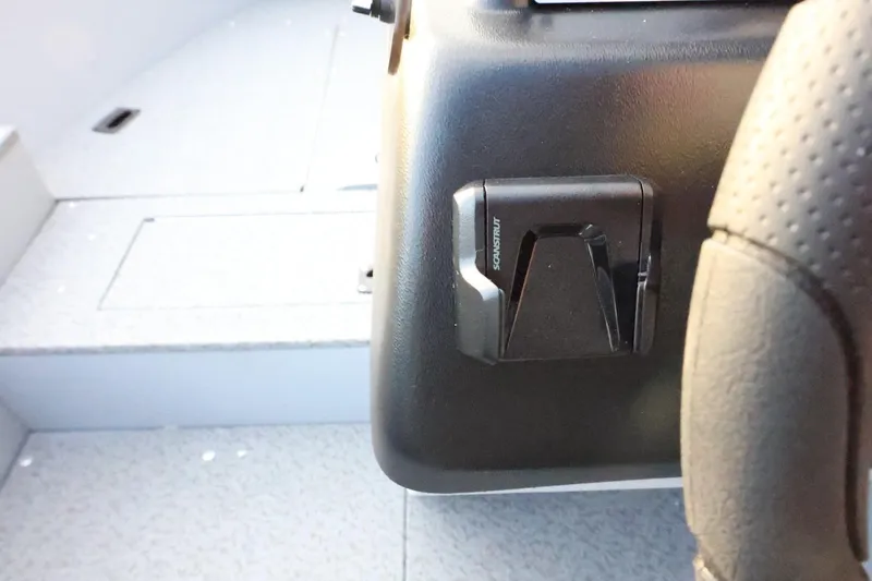 Slide: The Image of 2026 Lund 1600 Fury SS boat interior with steering wheel and dashboard detail. - 23