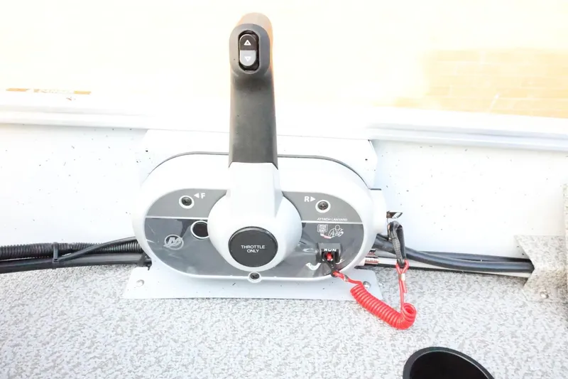 Slide: The Image of Throttle control panel of 2026 Lund 1600 Fury SS boat. - 24