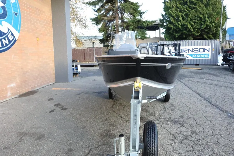 Slide: The Image of 2026 Lund 1600 Fury SS boat on trailer at a marine dealership. - 3