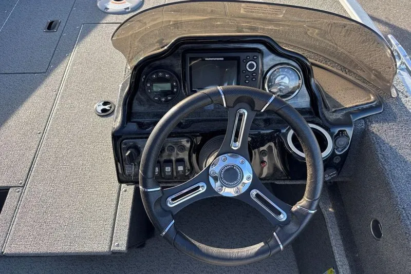 Slide: The Image of Steering console of 2024 Starweld Fusion Pro 16 SC boat with modern controls. - 10