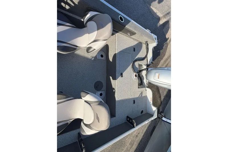 Slide: The Image of 2024 Starweld Fusion Pro 16 SC boat interior with seating and motor view. - 13