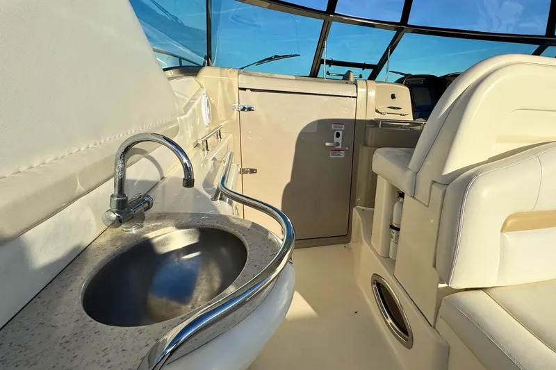Slide: The Image of 2008 Sea Ray 38 Sundancer yacht interior with sink and seating area. - 12