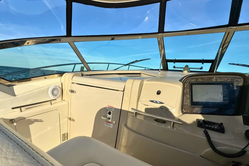Slide: The Image of Interior view of 2008 Sea Ray 38 Sundancer boat cockpit with navigation system. - 14