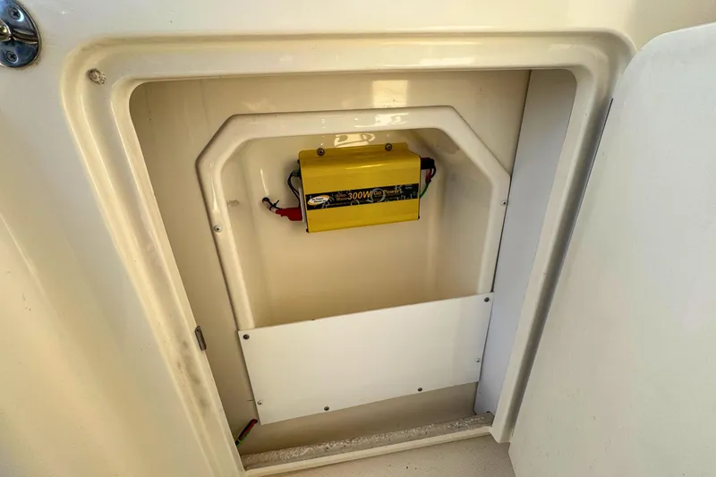 Slide: The Image of Electrical compartment of 2008 Sea Ray 38 Sundancer boat with yellow power inverter. - 15