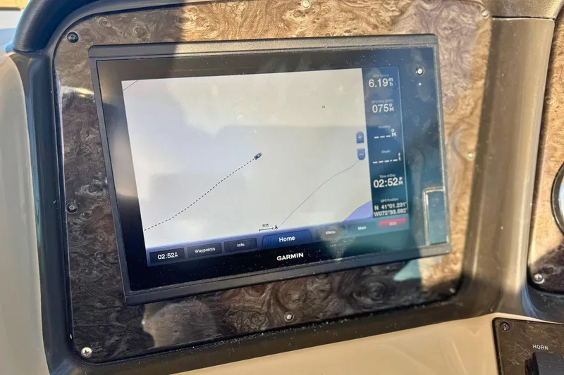 Slide: The Image of Garmin navigation display on 2008 Sea Ray 38 Sundancer boat dashboard. - 18