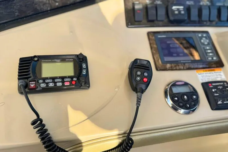 Slide: The Image of Control panel of a 2008 Sea Ray 38 Sundancer boat with communication equipment. - 19