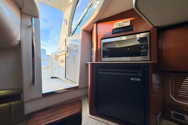 Slide: The Image of Interior of 2008 Sea Ray 38 Sundancer with microwave and compact fridge. - 25