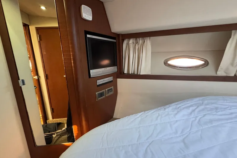 Slide: The Image of Interior cabin of 2008 Sea Ray 38 Sundancer with TV and porthole window. - 41