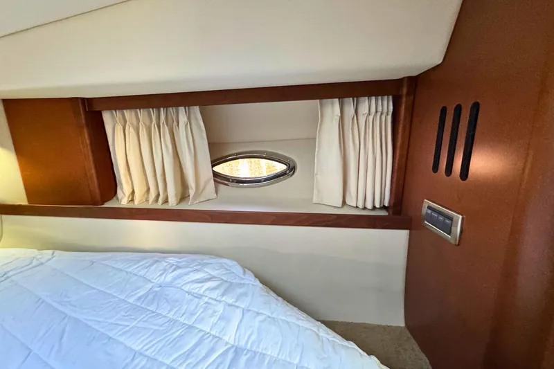 Slide: The Image of Interior cabin of 2008 Sea Ray 38 Sundancer with window and curtains. - 45