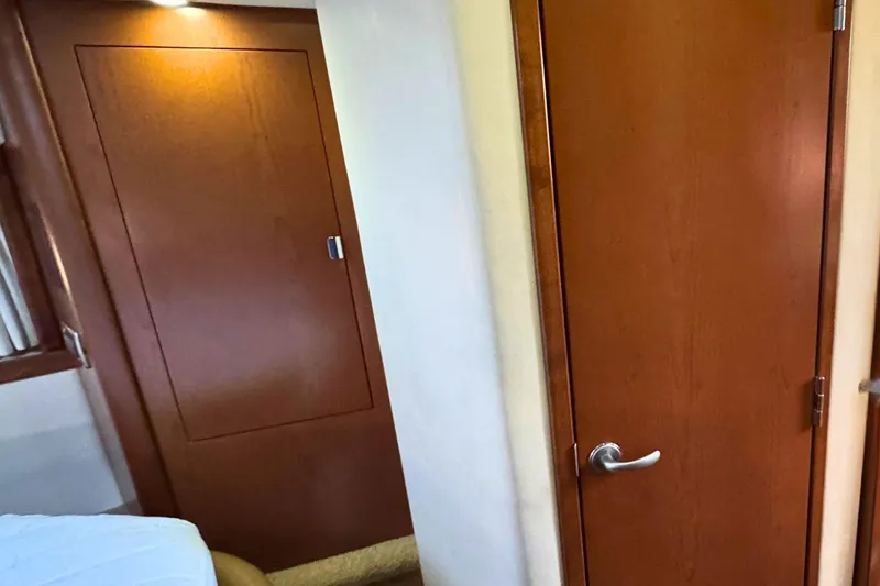 Slide: The Image of Interior of 2008 Sea Ray 38 Sundancer with wooden doors and modern design. - 46