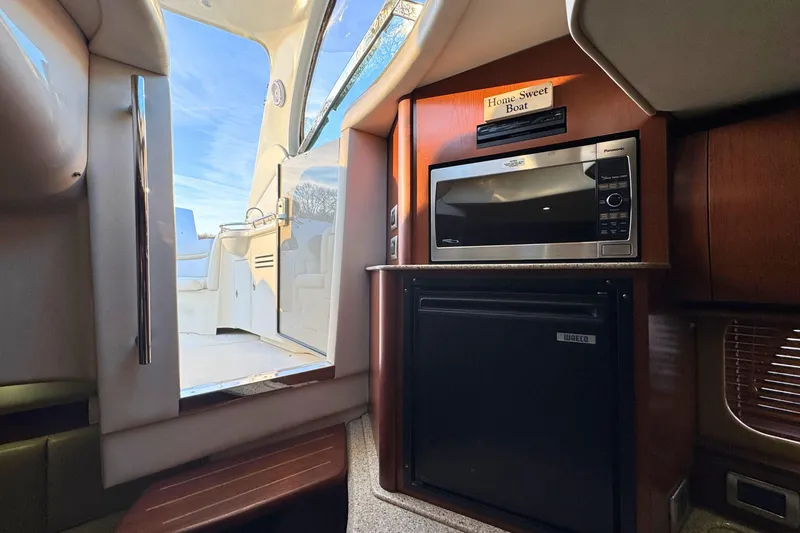 Slide: The Image of Interior of 2008 Sea Ray 38 Sundancer with microwave and mini fridge. - 49