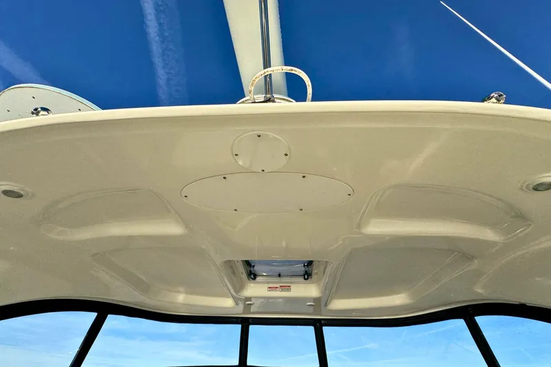 Slide: The Image of Interior view of 2008 Sea Ray 38 Sundancer boat ceiling against blue sky. - 54
