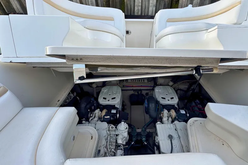 Slide: The Image of Engine compartment of a 2008 Sea Ray 38 Sundancer boat, showcasing dual engines. - 55