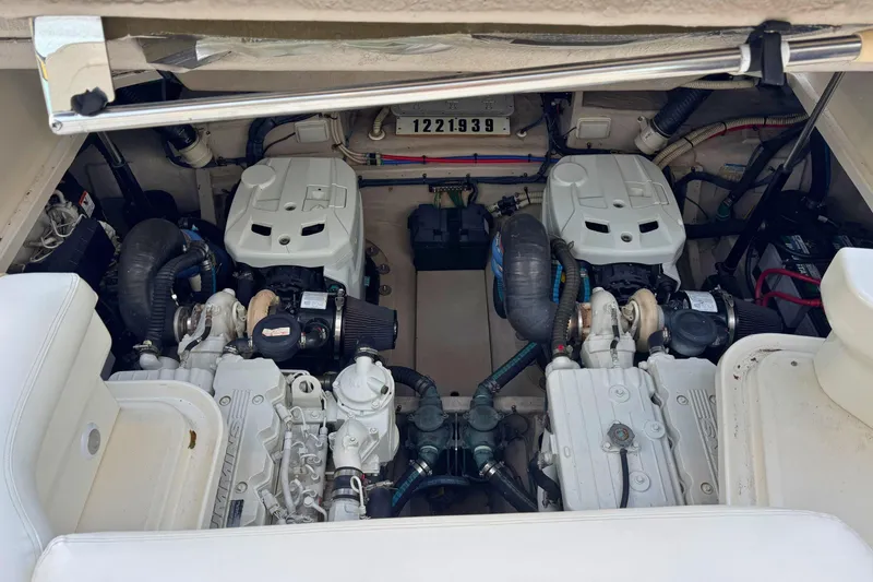 Slide: The Image of Engine compartment of a 2008 Sea Ray 38 Sundancer boat, showcasing dual engines. - 56