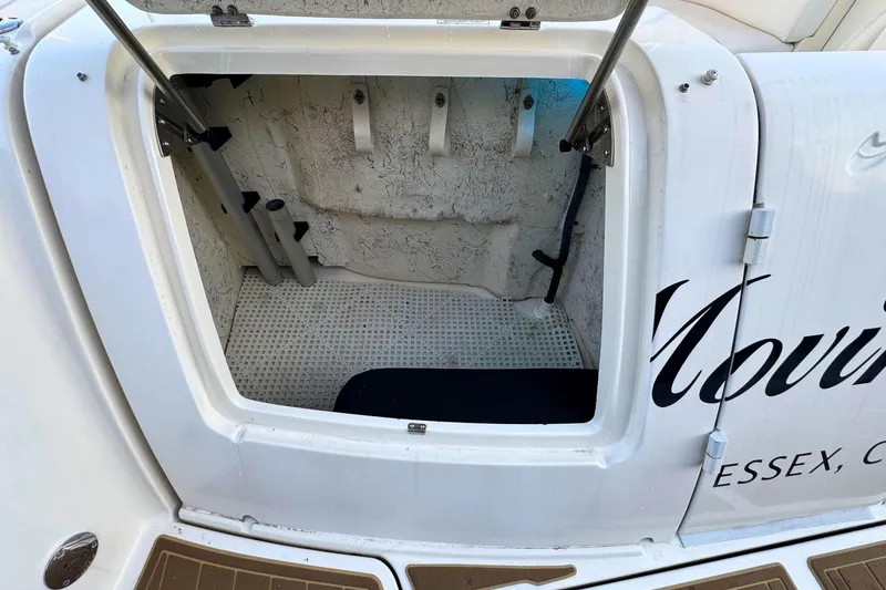 Slide: The Image of Open storage compartment on a 2008 Sea Ray 38 Sundancer boat. - 57