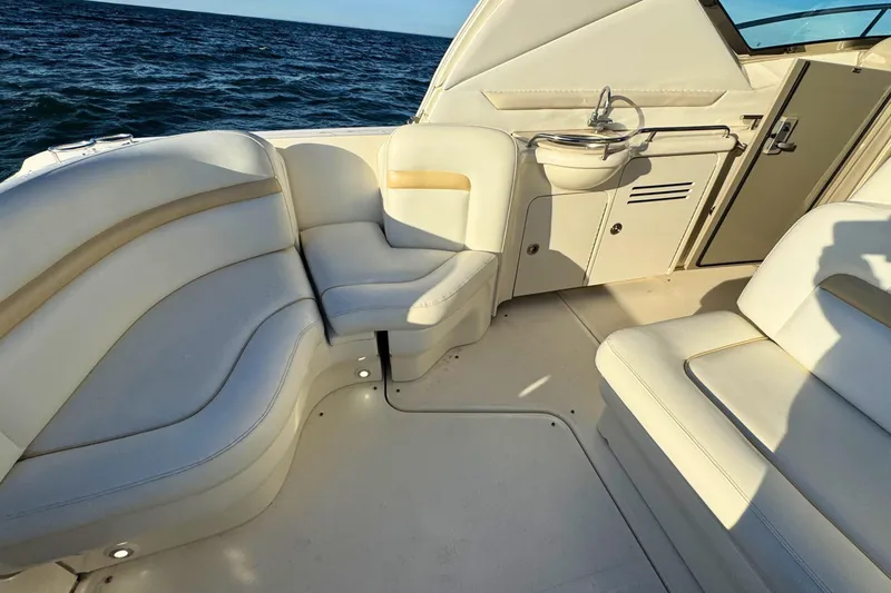 Slide: The Image of Luxurious 2008 Sea Ray 38 Sundancer boat interior with plush seating and ocean view. - 9