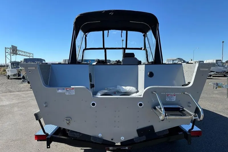 Slide: The Image of Interior of 2025 Starweld Fusion Pro 20 DC boat with seating and dashboard view. - 4