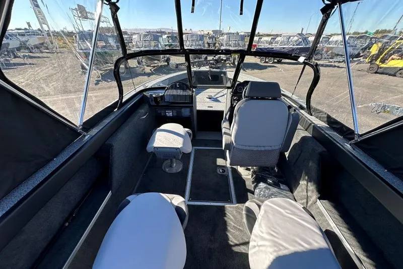 Slide: The Image of Steering console of 2025 Starweld Fusion Pro 20 DC boat, featuring modern controls. - 5