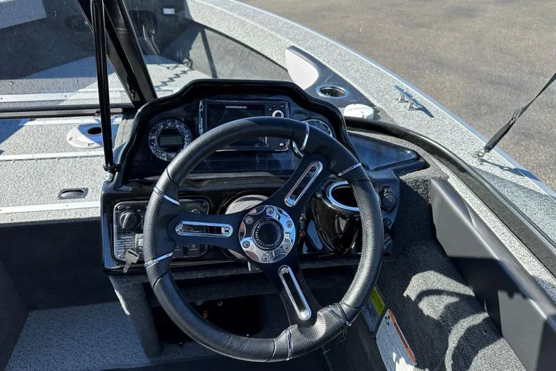 Slide: The Image of Interior view of a 2025 Starweld Fusion Pro 20 DC boat, featuring a spacious deck. - 6