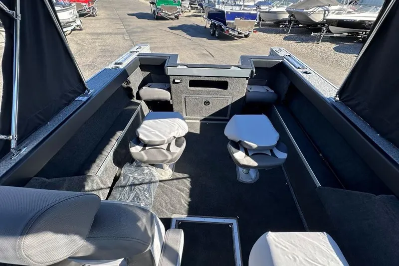 Slide: The Image of Interior view of a 2025 Starweld Fusion Pro 20 DC boat at a dealership. - 8