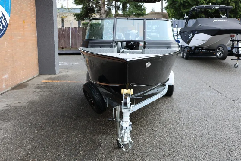 Slide: The Image of 2026 Lund 1775 Adventure Sport boat on trailer, parked outdoors. - 11
