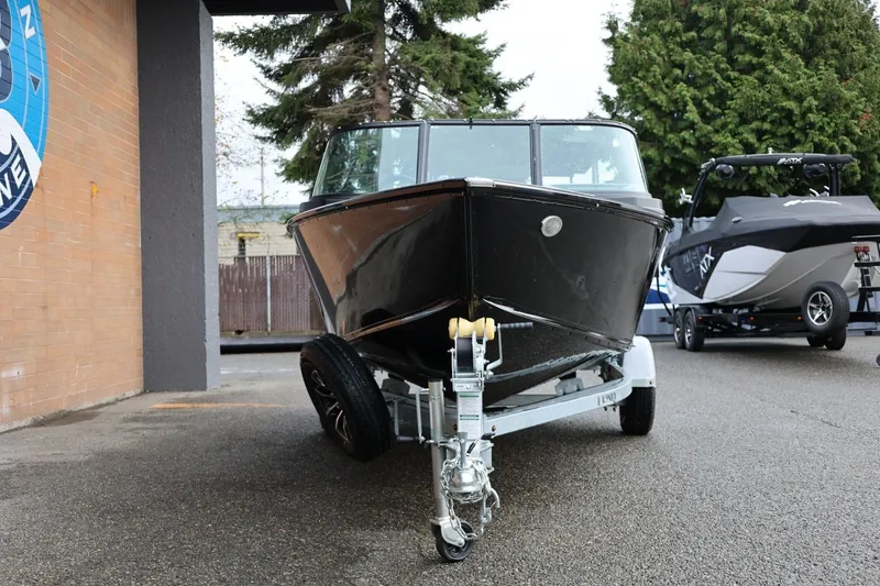 Slide: The Image of 2026 Lund 1775 Adventure Sport boat on trailer, parked outdoors. - 12