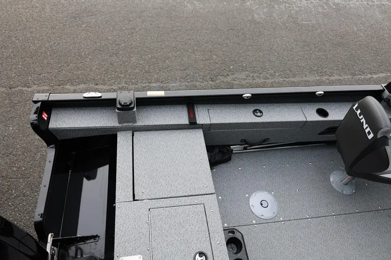 Slide: The Image of 2026 Lund 1775 Adventure Sport boat interior with seating and storage compartments. - 16