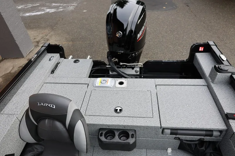 Slide: The Image of 2026 Lund 1775 Adventure Sport boat interior with Mercury engine and seating. - 17