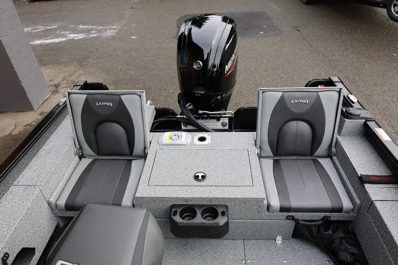 Slide: The Image of 2026 Lund 1775 Adventure Sport boat interior with dual seats and motor. - 18