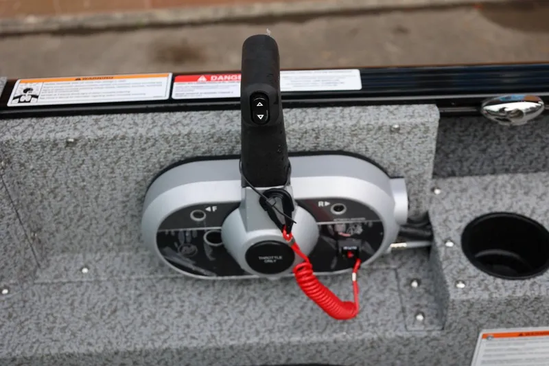 Slide: The Image of Throttle control of 2026 Lund 1775 Adventure Sport boat with safety lanyard. - 24