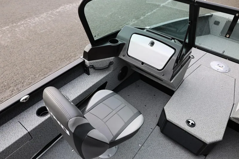 Slide: The Image of 2026 Lund 1775 Adventure Sport boat interior with seating and dashboard. - 31