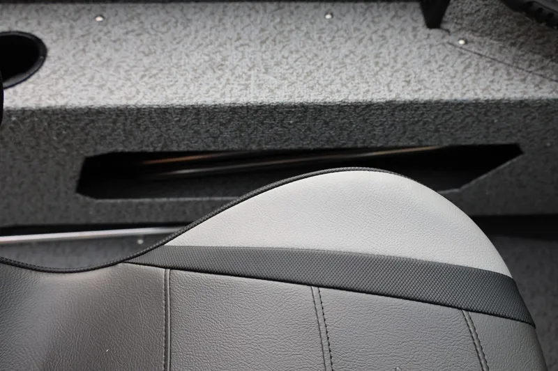 Slide: The Image of 2026 Lund 1775 Adventure Sport boat interior with gray seating and textured flooring. - 32