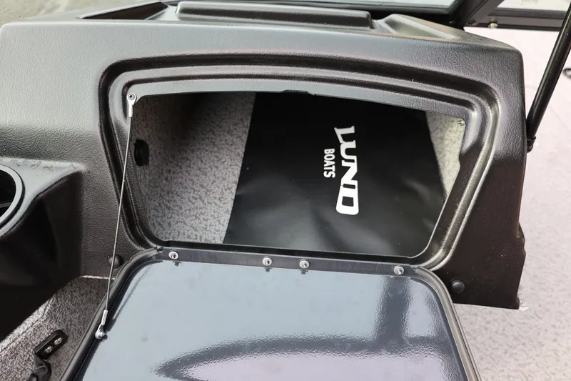 Slide: The Image of 2026 Lund 1775 Adventure Sport boat storage compartment with open hatch. - 35