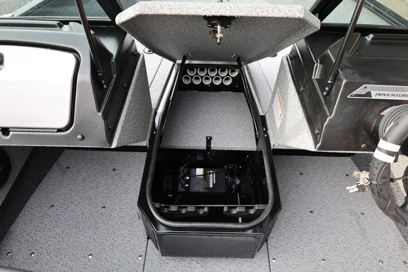 Slide: The Image of 2026 Lund 1775 Adventure Sport boat interior with open storage compartment. - 36