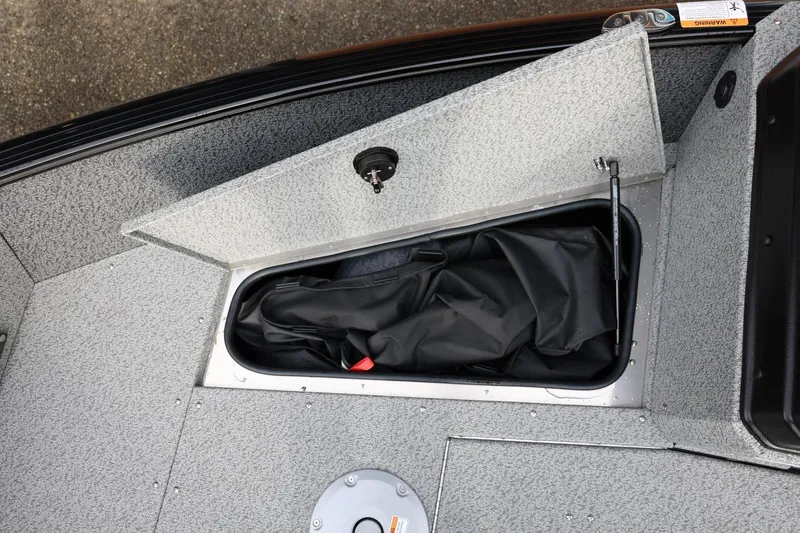 Slide: The Image of Storage compartment in 2026 Lund 1775 Adventure Sport boat, featuring a sleek, organized design. - 38