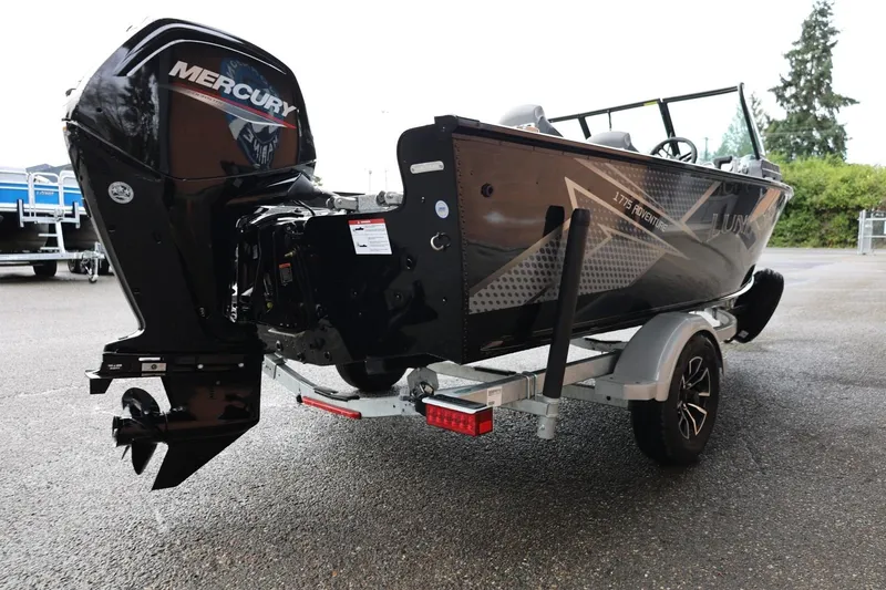 Slide: The Image of 2026 Lund 1775 Adventure Sport boat with Mercury outboard motor on a trailer. - 8