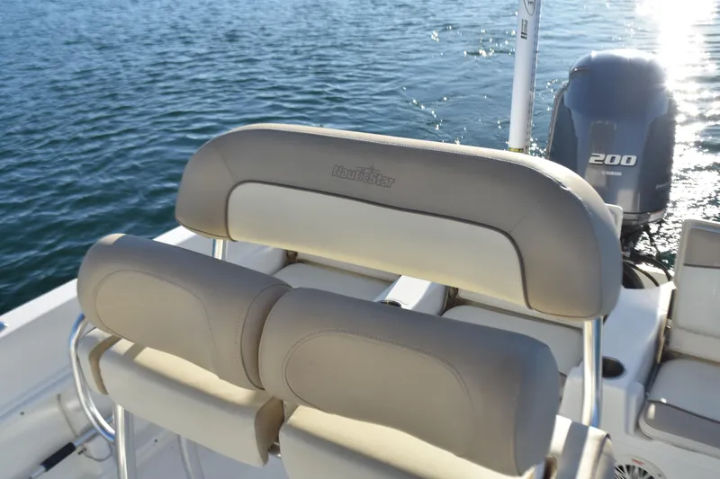 Slide: The Image of 2017 NauticStar 231 Angler boat with Yamaha 200 engine on water. - 13