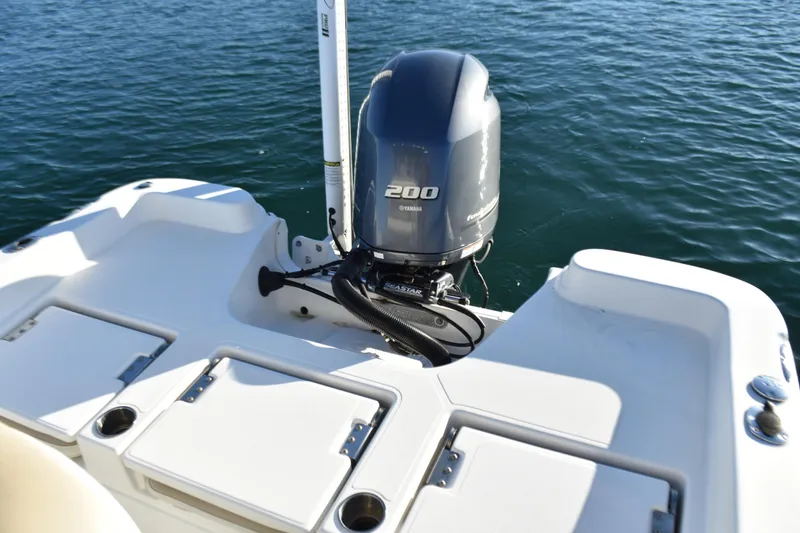Slide: The Image of 2017 NauticStar 231 Angler boat with Yamaha 200 engine on water. - 18