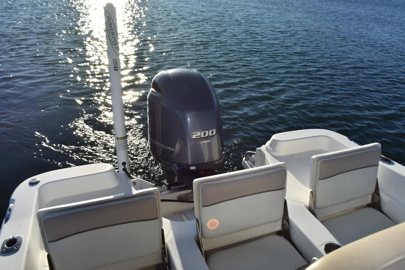 Slide: The Image of 2017 NauticStar 231 Angler boat with Yamaha 200 engine on calm water. - 19