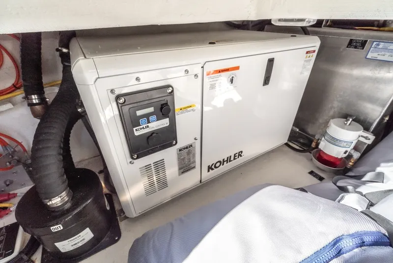 Slide: The Image of Kohler generator in the engine room of 2023 Cruisers Yachts 42 GLS. - 42